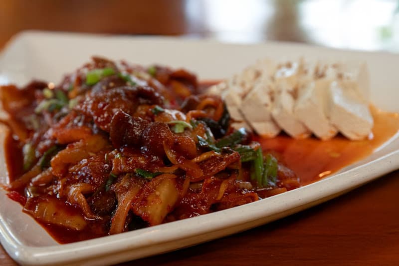 Caramelized short ribs on a hot platter at Matjoa House